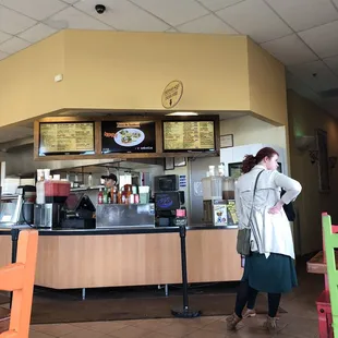 a woman standing in front of the counter