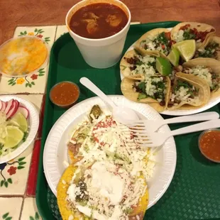 For two. Tacos 1.90 each (get the Buche!), menudo soup 9.75 (comes with 2 tostadas)