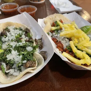 Steak tacos and Al pastor tacos, al pastor was better tortillas need help.