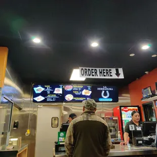 Order at the counter. Staff is friendly and accommodating. Great late night eats!