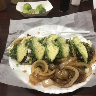Bisteck Tacos w/grilled onions,cheese and avocado