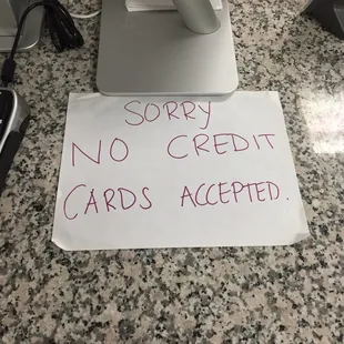 a sign that says sorry no credit cards accepted