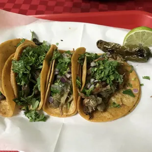 Tacos de carnitas, carne asada y chile verde con todo!