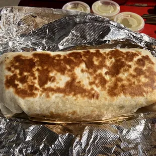 Love their huge Breakfast Burrito! Great to be back here.  I get it grilled. Green sauce here is so garlicky awesome