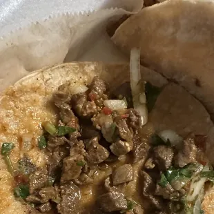 Steak taco  More like a tortilla taco with a spoon of steak