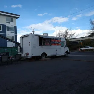 a taqueria truck parked in a parking lot