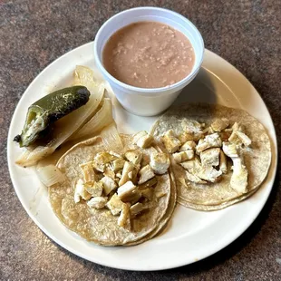 Two Pollo Tacos and a Side of Beans Before a Trip to the Toppings Bar