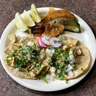 Two Pollo (Chicken) Street Tacos with Complimentary Onion Slices, Half Pepper, Radish Slices and Lime Wedges