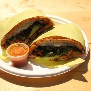 Torta, flavorful including: lettuce, tomato, onion, cilantro, salsa, cheese, mayonnaise, etc!