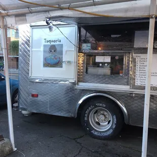 a taqueria truck parked in a parking lot