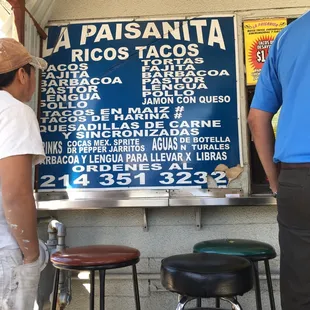 The Menu's are posted on the wall! There are two small tables and several bar stools, plan your food, 'To go!'  Prepared really quick!