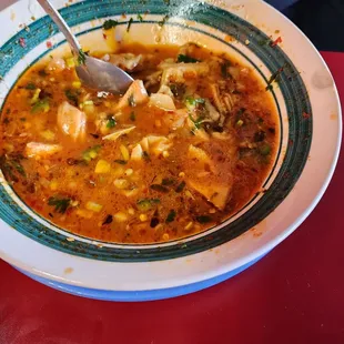 a bowl of soup with a spoon