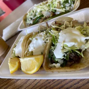 two tacos on a table