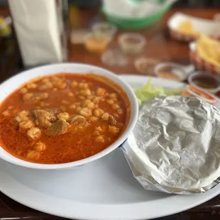 a bowl of soup and a sandwich