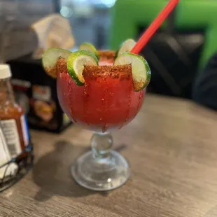 a bloody drink with a red straw
