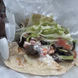Steak taco on flour tortilla