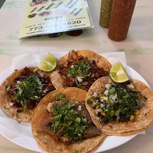  a plate of tacos and a drink