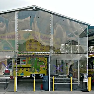 16 foot high covered dinning area with 10 benches to sit and dine in.