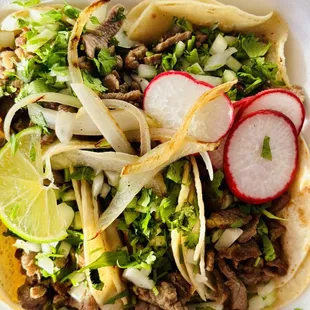 a close up of a taco in a styrofoam container