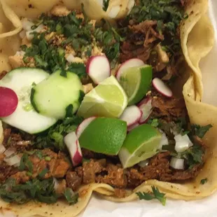 Four tacos: chicken, al pastor, barbacoa, and carnitas (barbacoa and al pastor are my favorites)