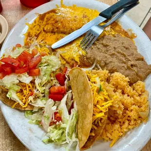 One of the TexMex dinner plates with cheese enchilada, crispy beef taco, and tostada