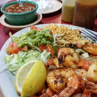 Grilled shrimp with peppers and onions, rice, beans, guac. Super delicious and authentic-tasting!