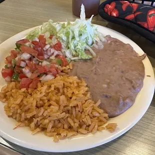 Parrillada Azteca sides: rice: great flavor   beans: good.  pico: didn&apos;t try because the server took it back with the not so great meat