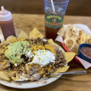 Super Nachos w/ carne asada meat &amp;  complementary chips and salsa tea is additional