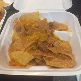 This is what they call Bean &amp; Cheese Nachos.. Skimpy Ass Nachos.. step Y'alls game Up !!!