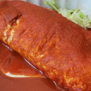 a piece of meat in a sauce