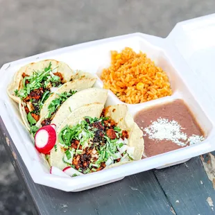 3 Pastor tacos with rice and beans IG: michellelieats