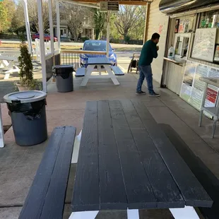 a man standing in front of a store