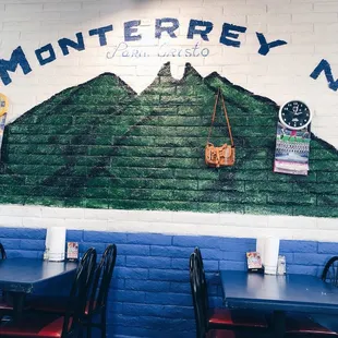 a mural on the wall of a restaurant
