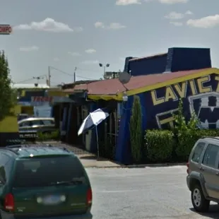 a view of a taqueria from across the street
