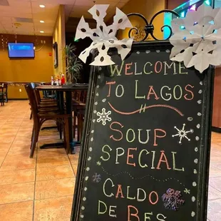 a blackboard with a sign that says welcome to lagoss soup special