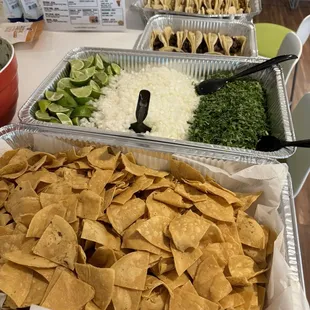 Chips, Limes, Onions, Cilantro, Tacos