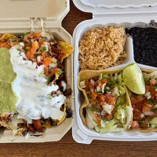 Large al pastor nachos and 2 fish tacos with rice and beans