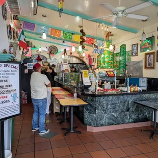 Inside. View from entrance. Ordering line and salsa bar. Very limited indoor and outdoor seating.