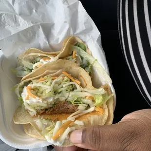 Barbecue chicken Taco. With sour cream and lettuce cheese and cilantro and onions.