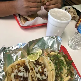 Top (w/hubby&apos;s hands): Tortas  Bottom: 2x Marinated Pork Tacos &amp; 2x Azada/Steak Tacos