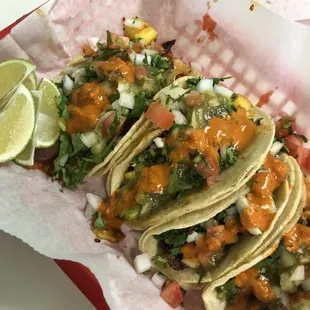 I asked for two steak and two al pastor. I added onion, cilantro, pico, green&amp;red salsa and topped off each bite with a squeeze of like.