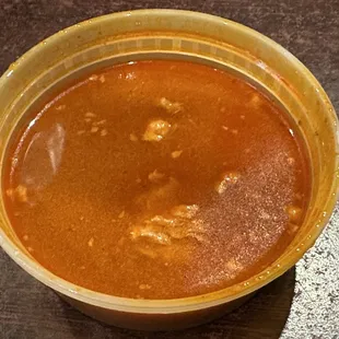 Dipping consommé that comes with quesabirria.  Bigger bc I ordered two of the quesabirria