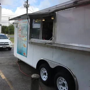 a taqueria truck parked in a parking lot