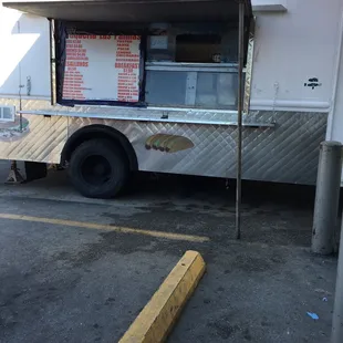 a taqueria truck parked in a parking lot