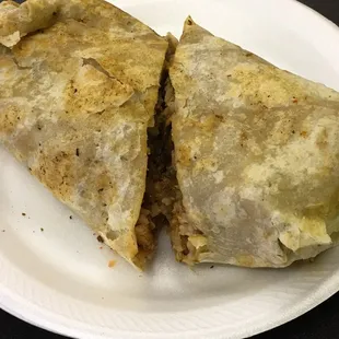 Large burrito with meat, beans, rice and etc...