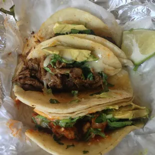 Bottom to top: chicharron, fajita, and barbacoa tacos.