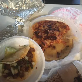 a plate of tacos and a sandwich