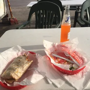 Chorizo burrito, two tacos al pastor, and big Fanta