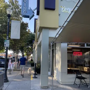Street entrance. Outdoor seating to the right