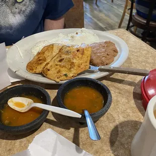 Gringos plate with potatoes underneath beans and eggs
